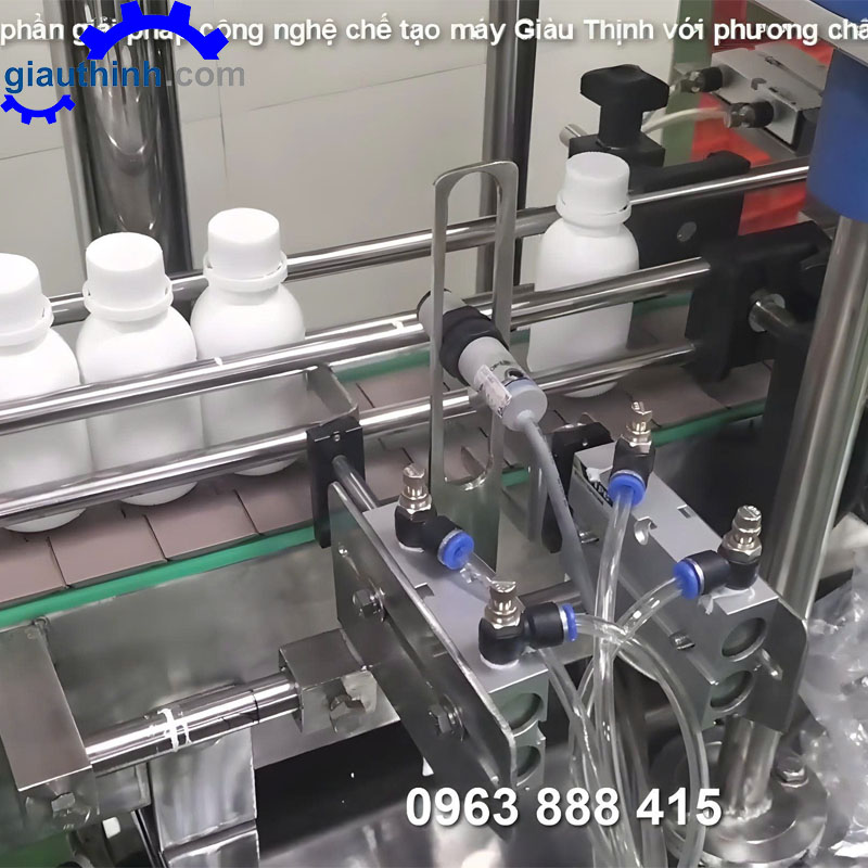 Máy siết nắp chai