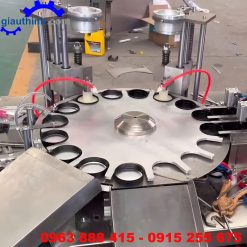 Máy cho màng seal nhôm vào nắp