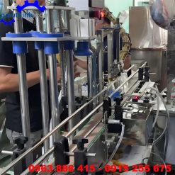 Máy cấp nắp và đóng nắp chai
